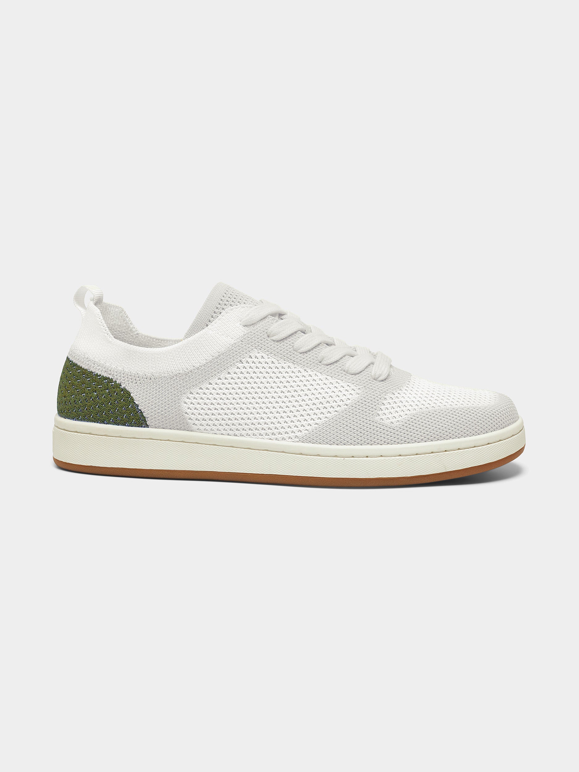 A single green leaf against a white background.