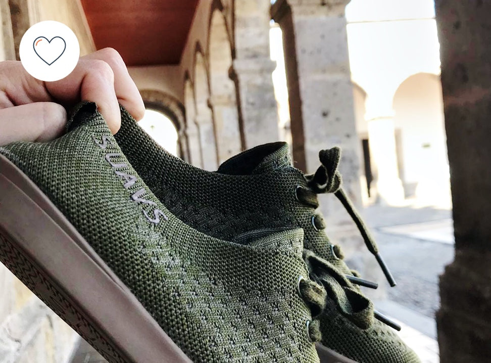 Image of someone holding a pair of SUAVS in their hand.