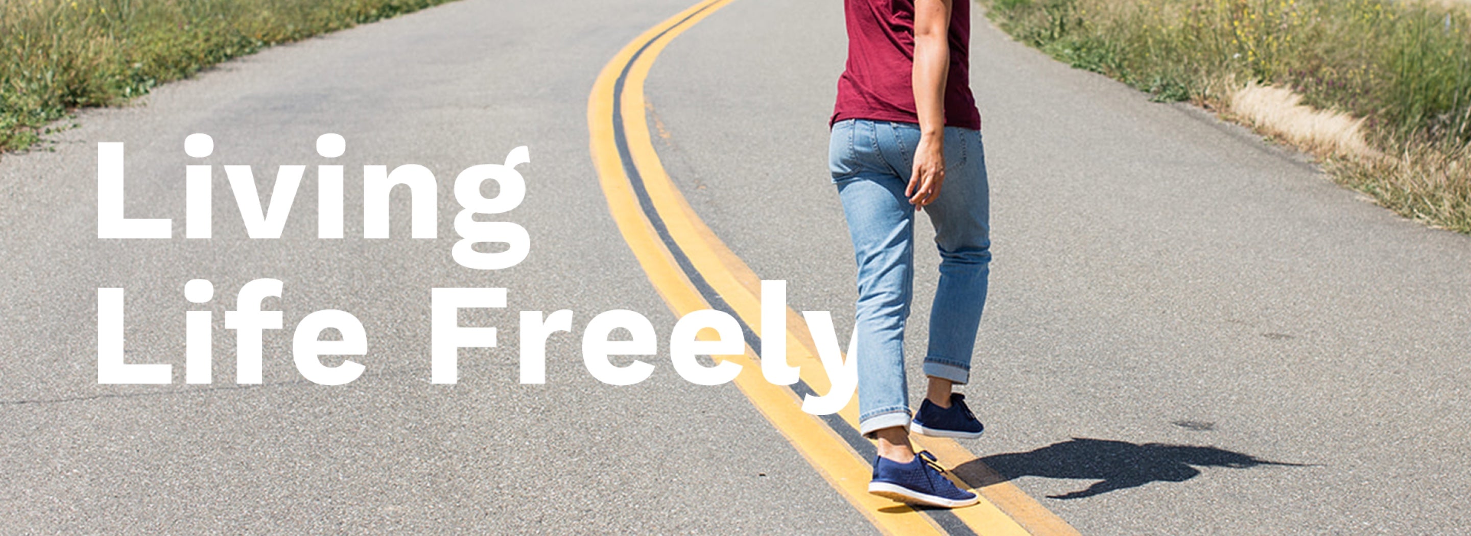 Living Life Freely.  Woman wearing Zilker sneakers walking freely down a road.